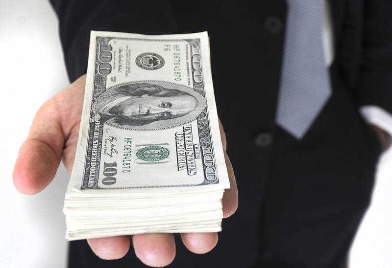 a person handing over money